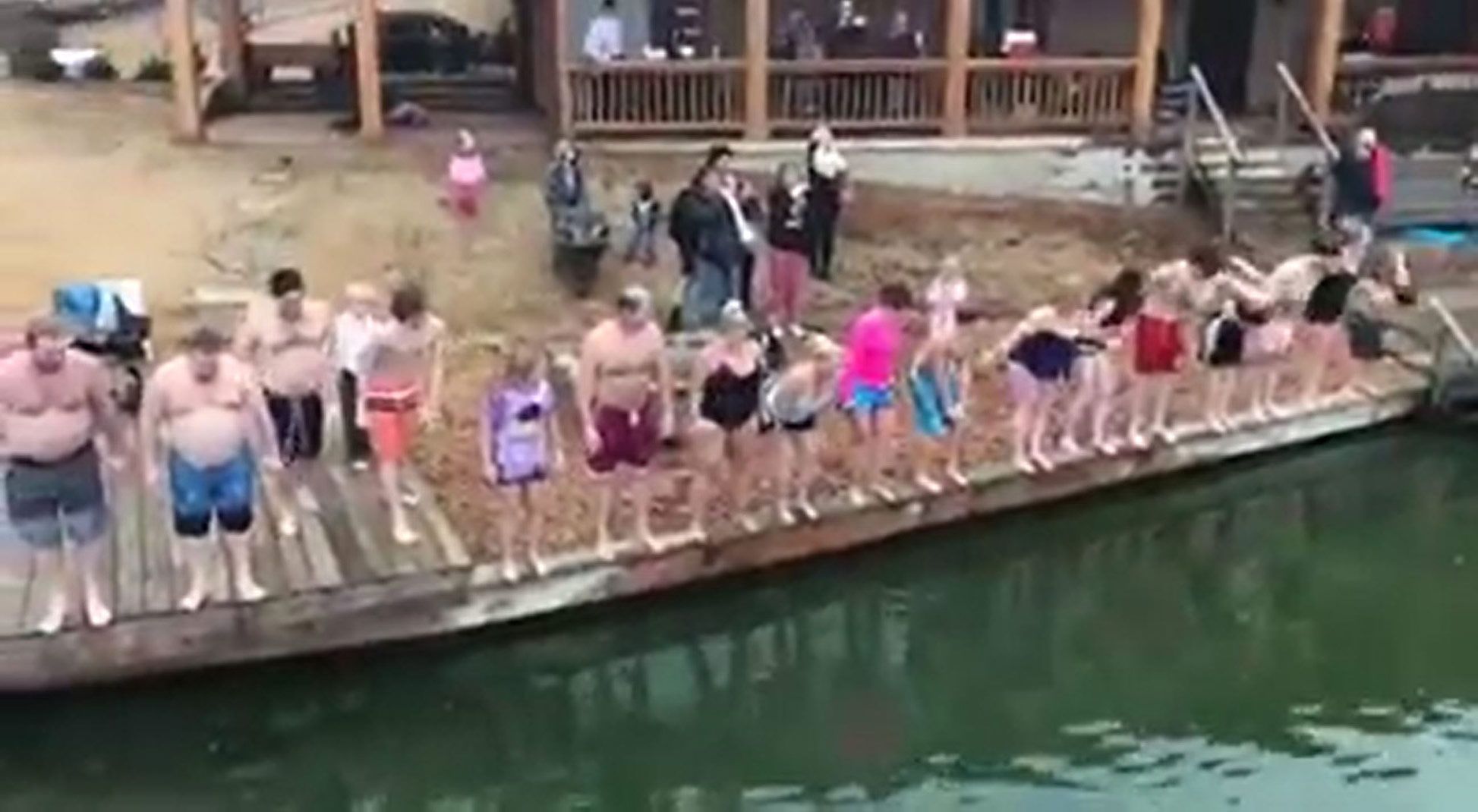 Twenty people lined up to jump into Garner Lake
