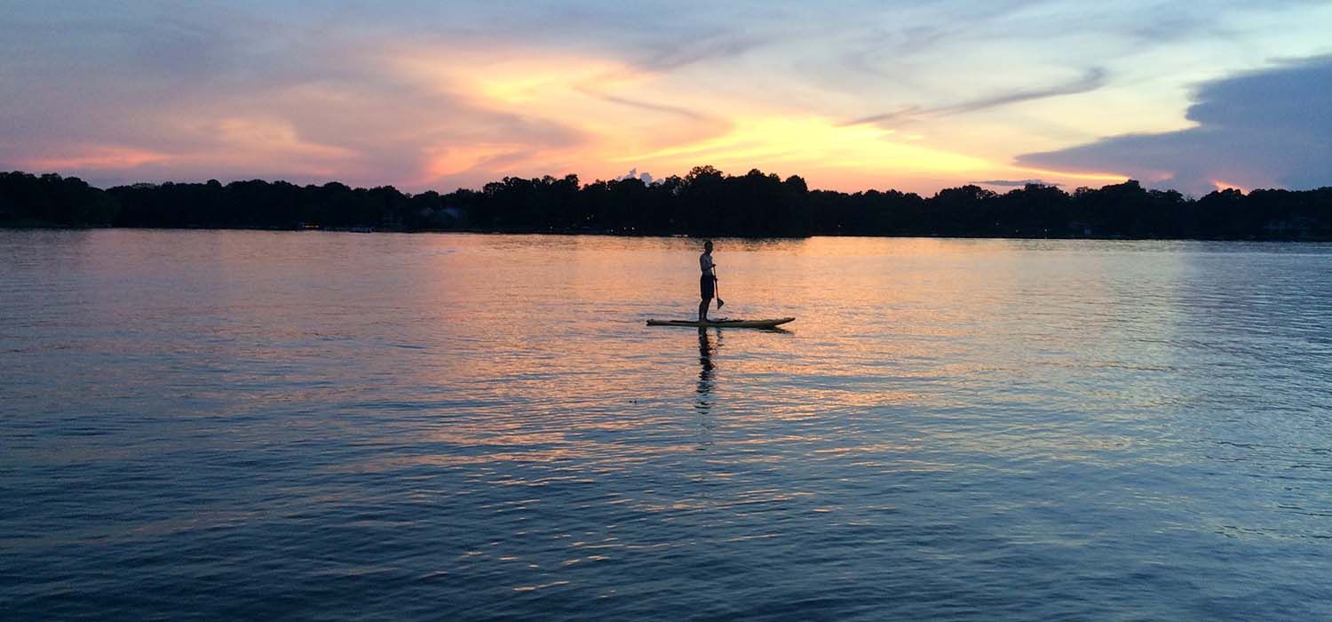 Paddleboarder at Sunset on Garner Lake in Lakeland, TN